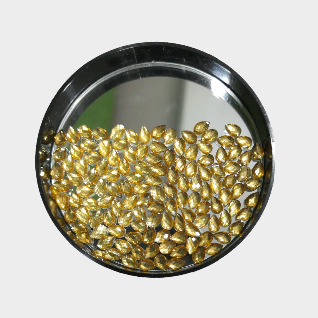Golden translucent diamond cut drop shape kundan Golden translucent diamond cut drop shape kundan
